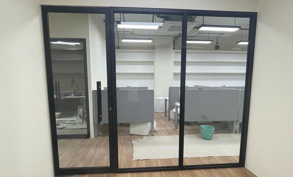 Frameless glass shower screen installation